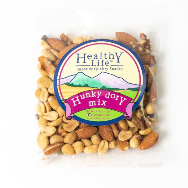 A packaged trail mix containing almonds, pecans, and cashews, labeled 'Healthy Life Snacks Hunky Dory Mix'.
