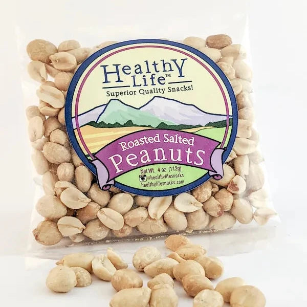 A clear plastic package of Healthy Life brand roasted salted peanuts with a few peanuts scattered in front of the package.